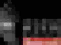 weißes Logo der TMK Niedernsill mit musikalischem Bezug und traditionellem Design